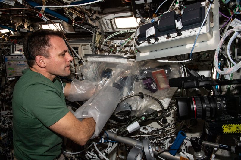 Caption: NASA astronaut Josh Cassada works with Redwire’s 3D BioFabrication Facility on the ISS. (Credit: NASA)
