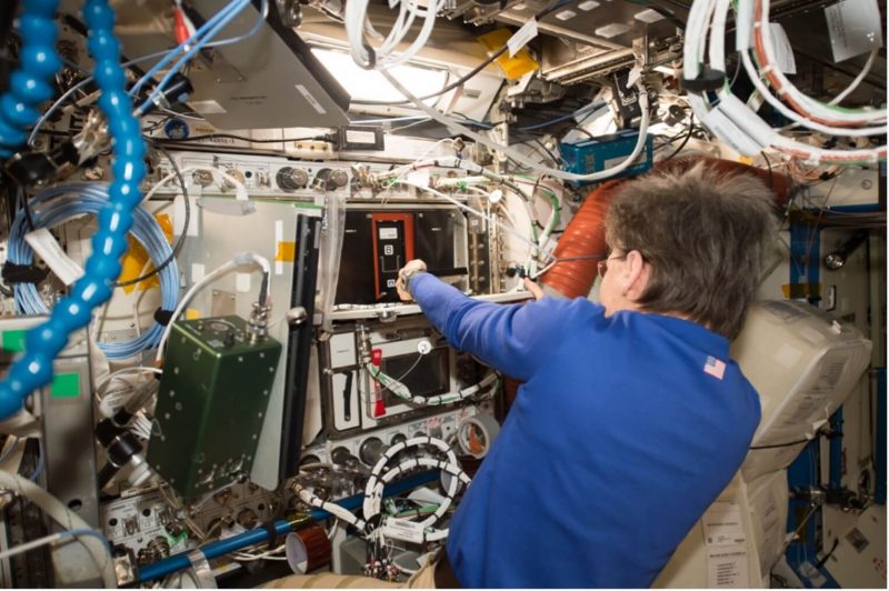 NASA astronaut Peggy Whitson works with Redwire's ADSEP facility on the International Space Station.
