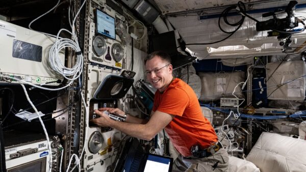 NASA astronaut Nick Hague with Arthrospira-C on the ISS. Credit: NASA