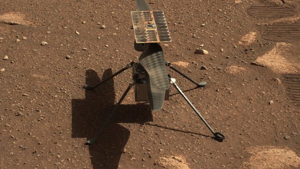 Caption: NASA’s Ingenuity helicopter on the surface of Mars, as seen in an image taken by the Perseverance Rover. (Credit: NASA)