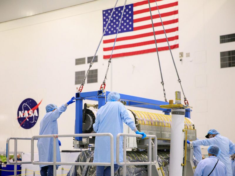 Caption: iROSA wings five and six undergo flight package integration in the Space Station Processing Facility at NASA’s Kennedy Space Center in Florida. (Credit: NASA)